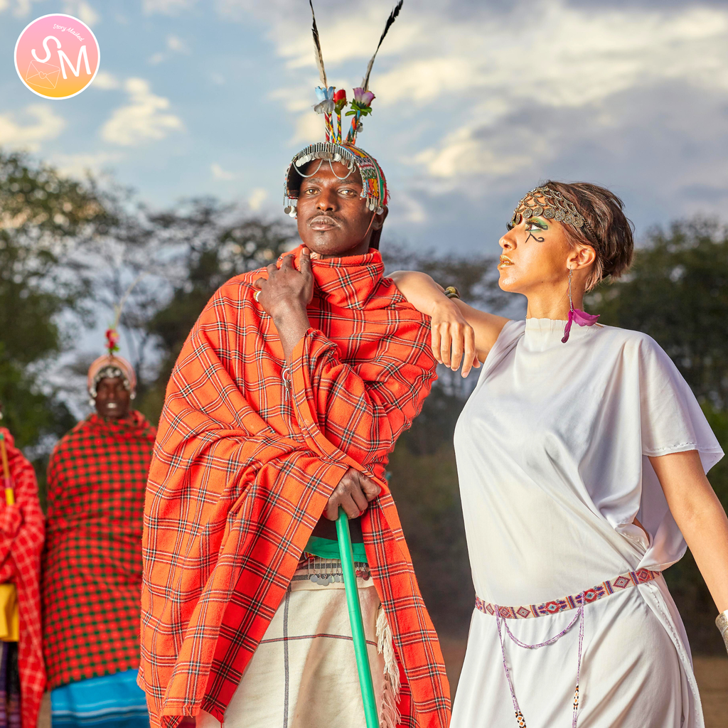 Two people in traditional maasai attire with a scenic background. with love from kenya, story mailed letters delivered to your mailbox each month